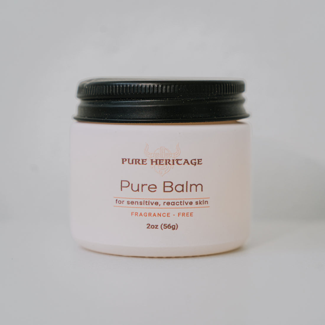 Jar of Pure Heritage Pure Balm on a light gray background